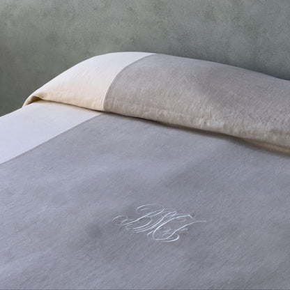 bed cover with sewing in contrasting colours