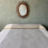 bed cover with sewing in contrasting colours